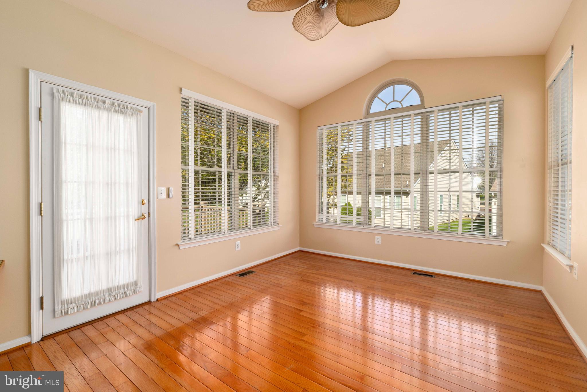 1028 Conway Court Warminster, PA 18974 - Photo 18 of 32 a view of an empty room with wooden floor and a window