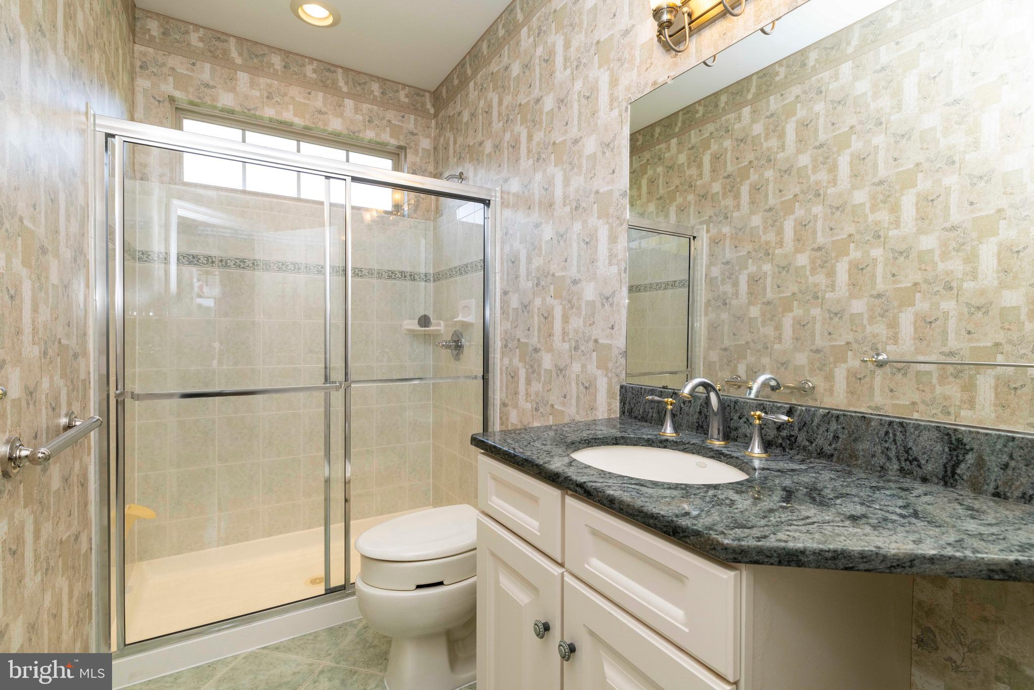 1028 Conway Court Warminster, PA 18974 - Photo 25 of 32 a bathroom with a granite countertop sink toilet and shower