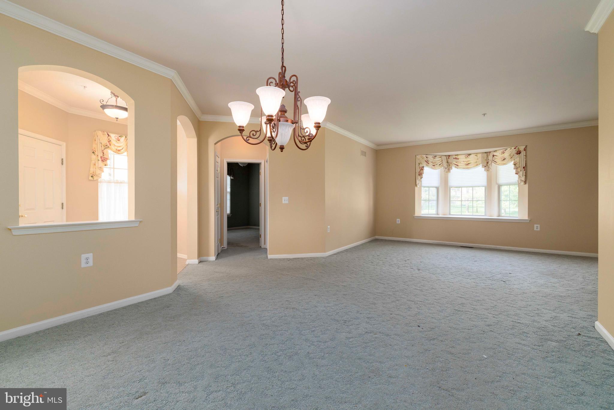 1028 Conway Court Warminster, PA 18974 - Photo 5 of 32 a view of a big room with windows and chandelier