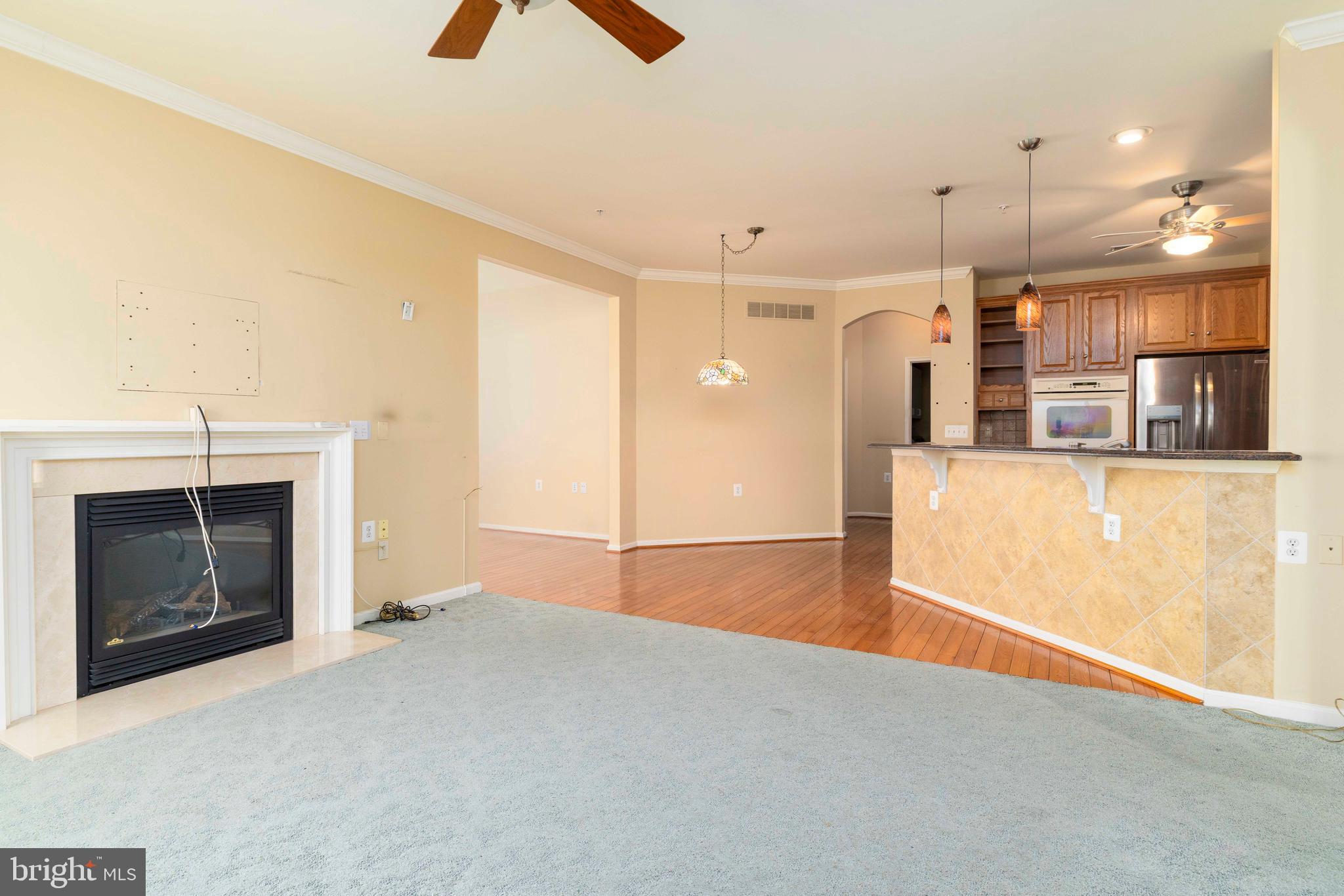 1028 Conway Court Warminster, PA 18974 - Photo 10 of 32 a view of a kitchen with a sink and a fireplace