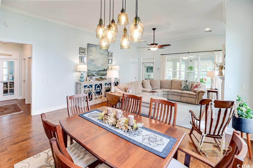 2110 Silver Spring Lane Myrtle Beach, SC 29577 - Photo 11 of 40 Dining room with plenty of natural light, ceiling fan, crown molding, and wood finished floors