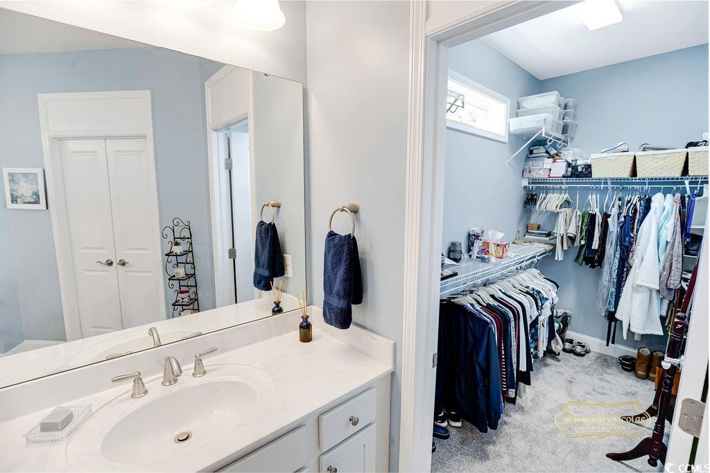 2110 Silver Spring Lane Myrtle Beach, SC 29577 - Photo 14 of 40 Bathroom featuring vanity and a spacious closet