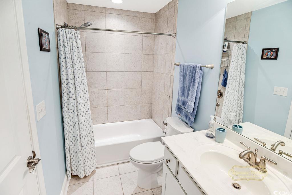 2110 Silver Spring Lane Myrtle Beach, SC 29577 - Photo 17 of 40 Full bath with vanity, tile patterned floors, and shower / tub combo