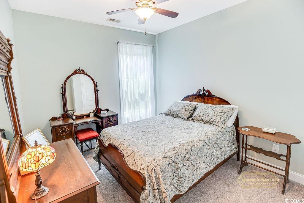2110 Silver Spring Lane Myrtle Beach, SC 29577 - Photo 18 of 40 Carpeted bedroom featuring ceiling fan and baseboards