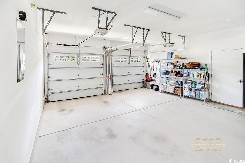 2110 Silver Spring Lane Myrtle Beach, SC 29577 - Photo 23 of 40 Garage with a garage door opener