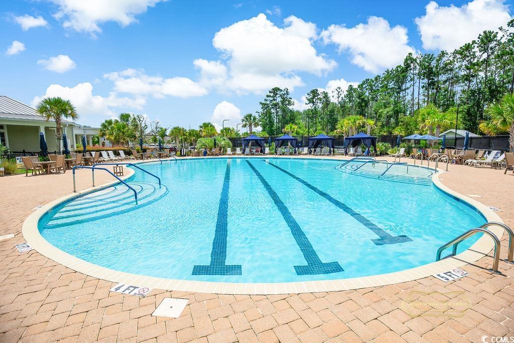 2110 Silver Spring Lane Myrtle Beach, SC 29577 - Photo 29 of 40 Community pool with a patio area