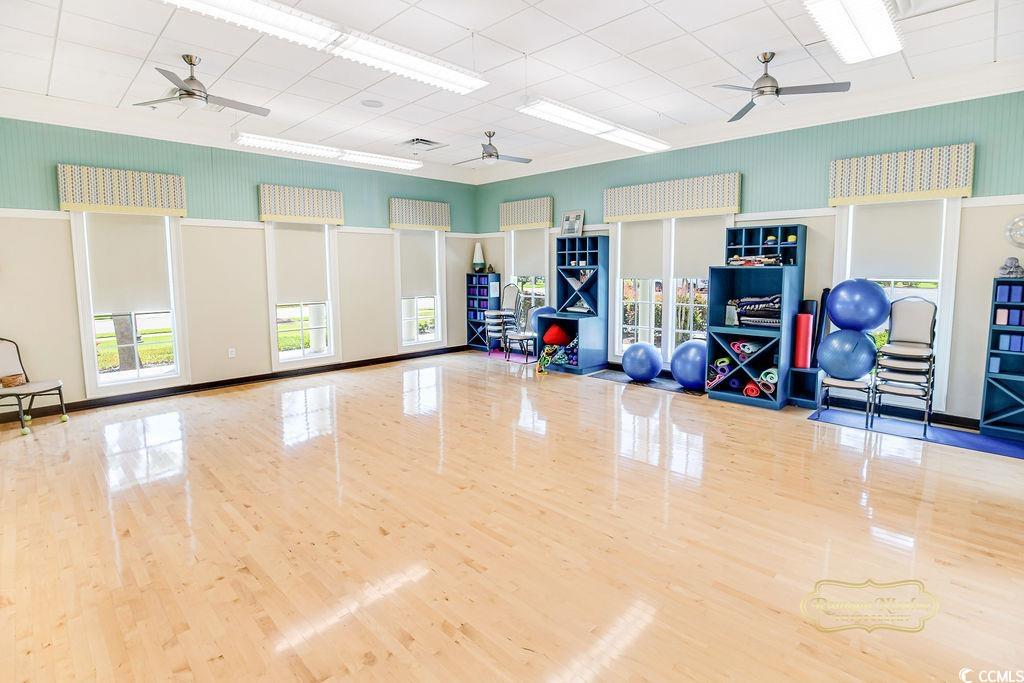2110 Silver Spring Lane Myrtle Beach, SC 29577 - Photo 30 of 40 Exercise area with a ceiling fan and wood finished floors