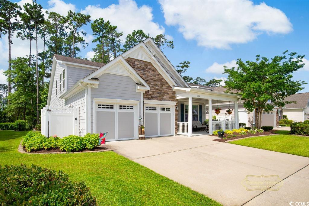 2110 Silver Spring Lane Myrtle Beach, SC 29577 - Photo 38 of 40 Craftsman inspired home featuring driveway, a porch, a garage, and stone siding