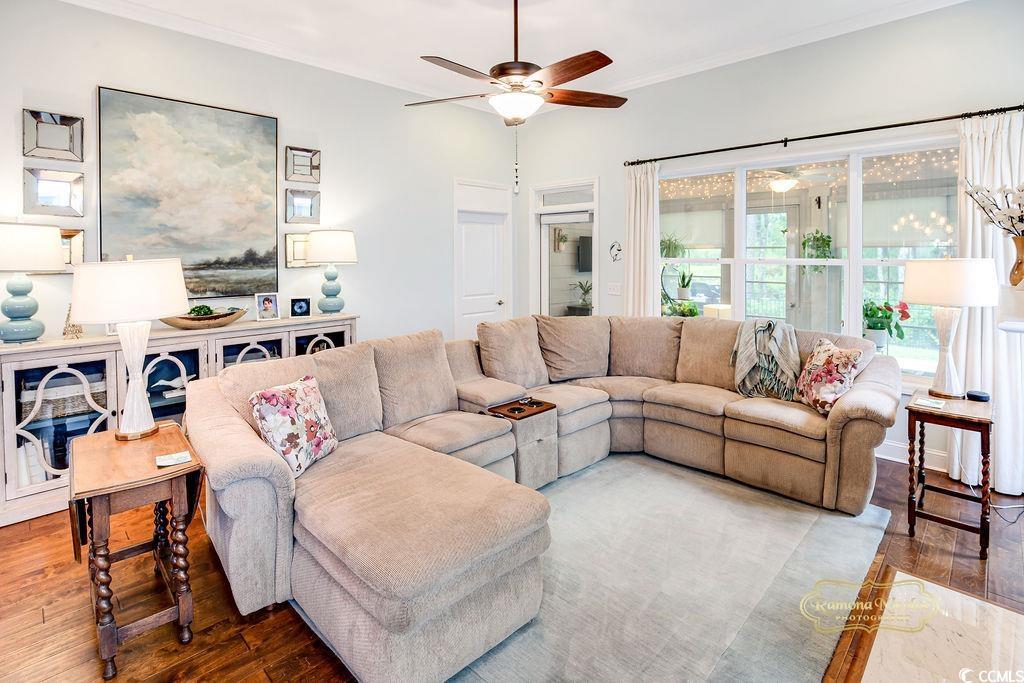 2110 Silver Spring Lane Myrtle Beach, SC 29577 - Photo 9 of 40 Living area featuring a ceiling fan, wood finished floors, and crown molding