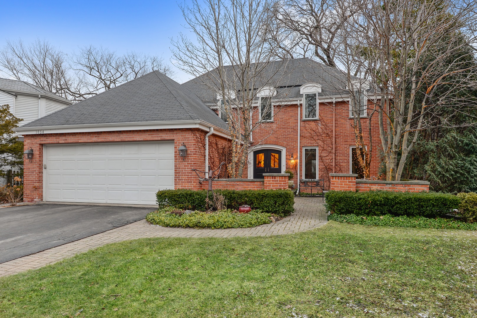 1034 Pontiac Road Wilmette, IL 60091 - Photo 1 of 32 a front view of a house with a yard