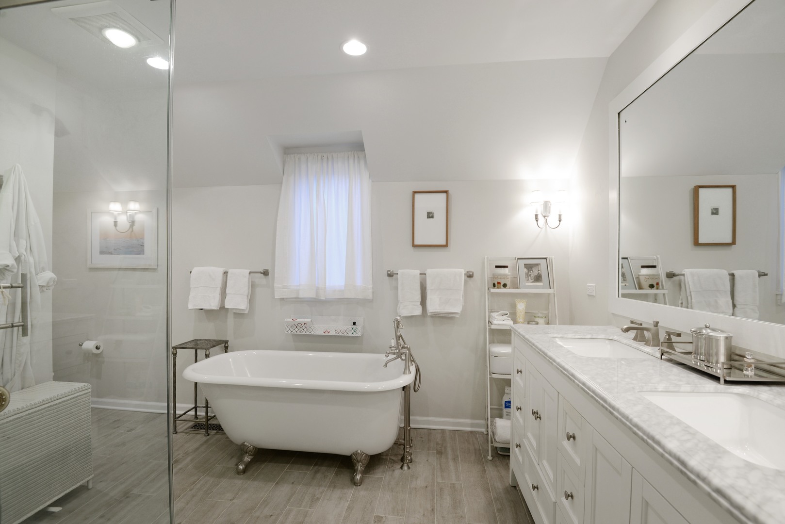 1034 Pontiac Road Wilmette, IL 60091 - Photo 17 of 32 a spacious bathroom with a tub sink and mirror