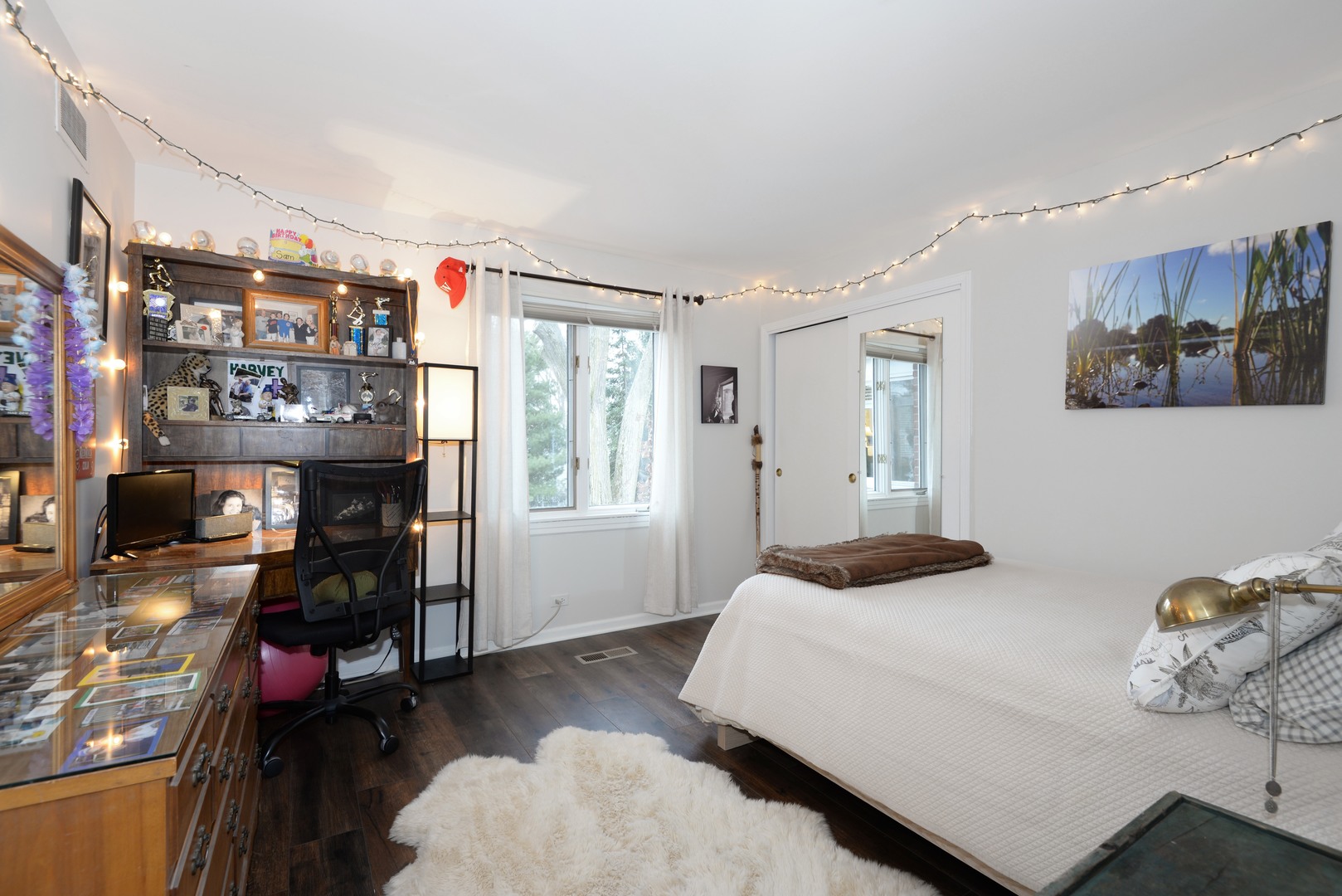 1034 Pontiac Road Wilmette, IL 60091 - Photo 19 of 32 a bedroom with a bed and wooden floor