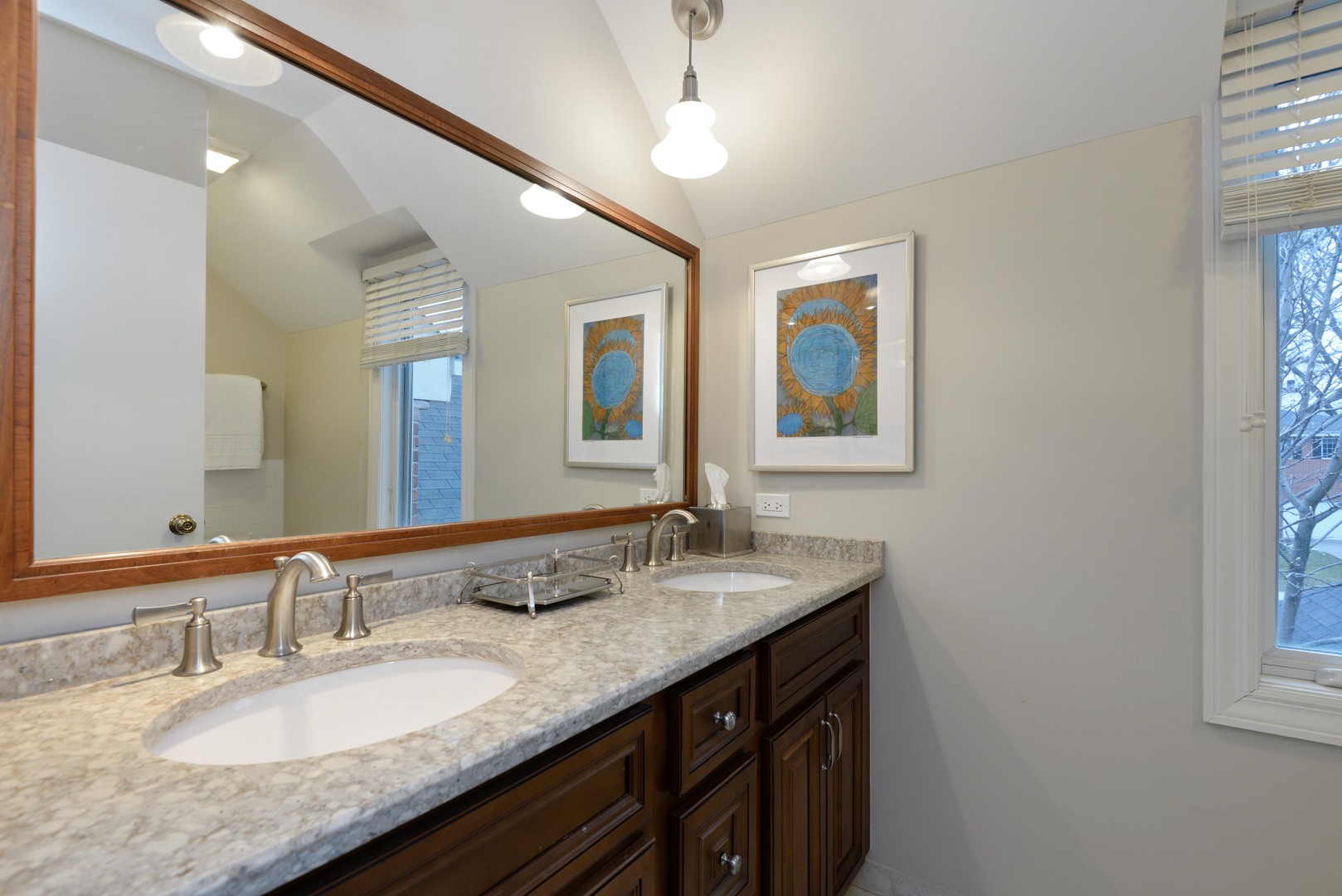 1034 Pontiac Road Wilmette, IL 60091 - Photo 20 of 32 a bathroom with a granite countertop double vanity and a mirror
