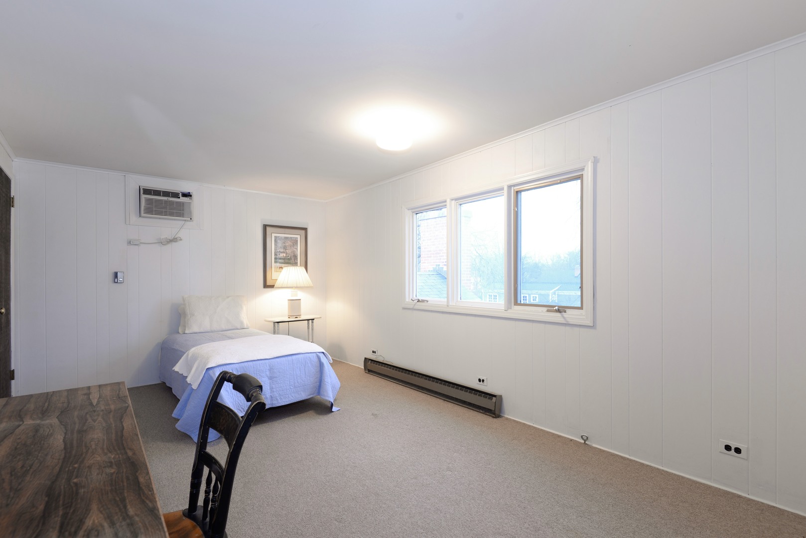 1034 Pontiac Road Wilmette, IL 60091 - Photo 24 of 32 a bedroom with a bed and a window