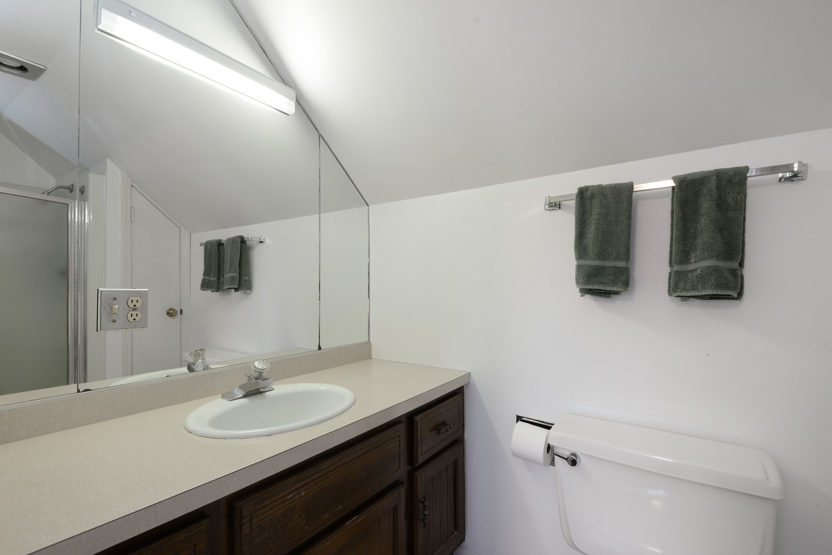 1034 Pontiac Road Wilmette, IL 60091 - Photo 25 of 32 a bathroom with a sink and mirror
