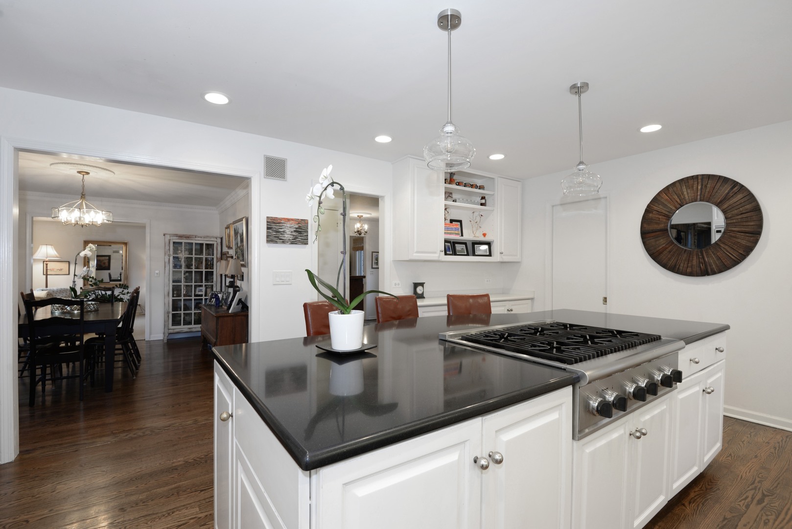 1034 Pontiac Road Wilmette, IL 60091 - Photo 10 of 32 a kitchen with granite countertop a stove a sink a dining table and chairs