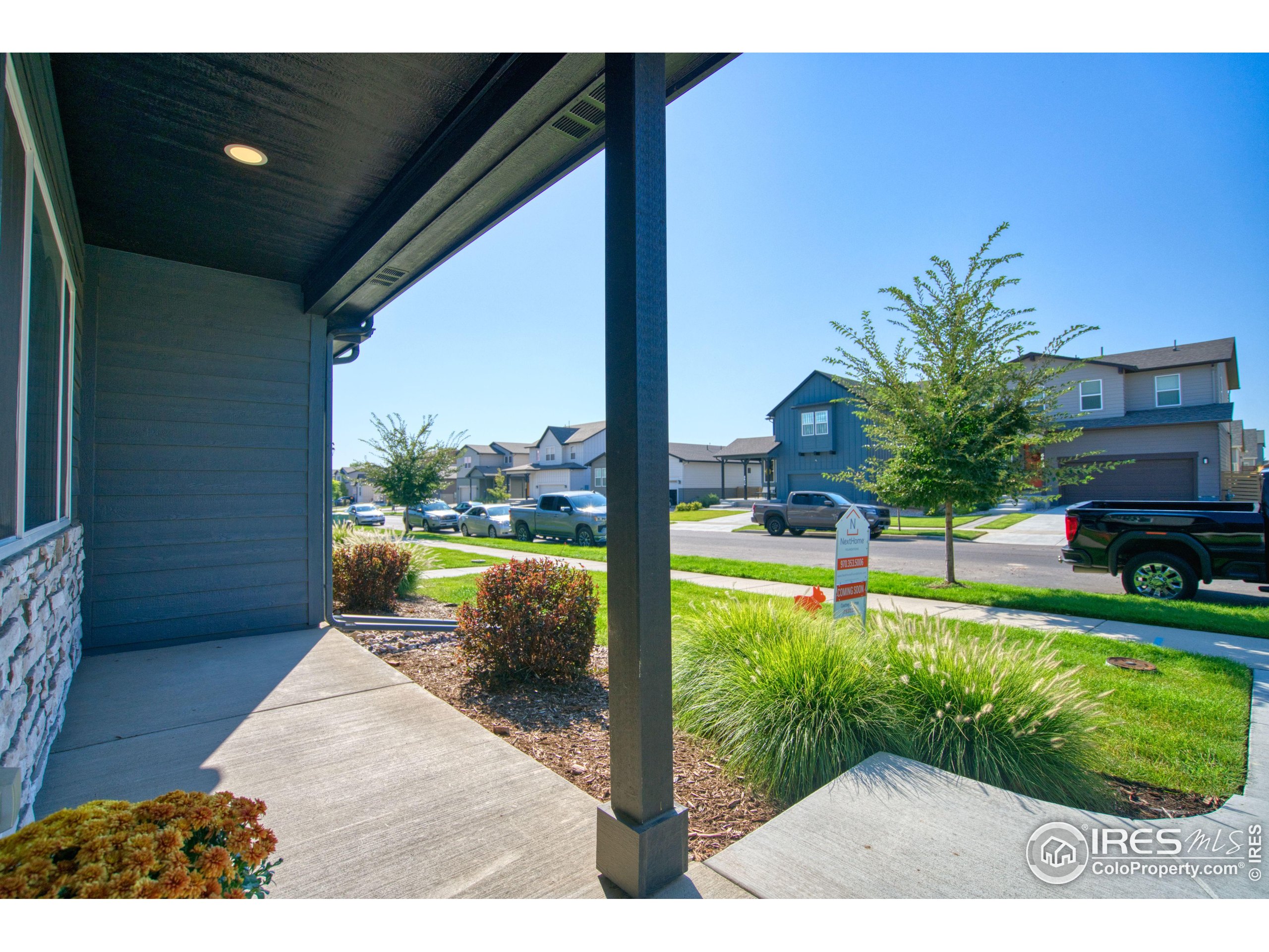 6615 4th St Road, Unit 2 Greeley, CO 80634 - Photo 21 of 31 a view of a porch and garden