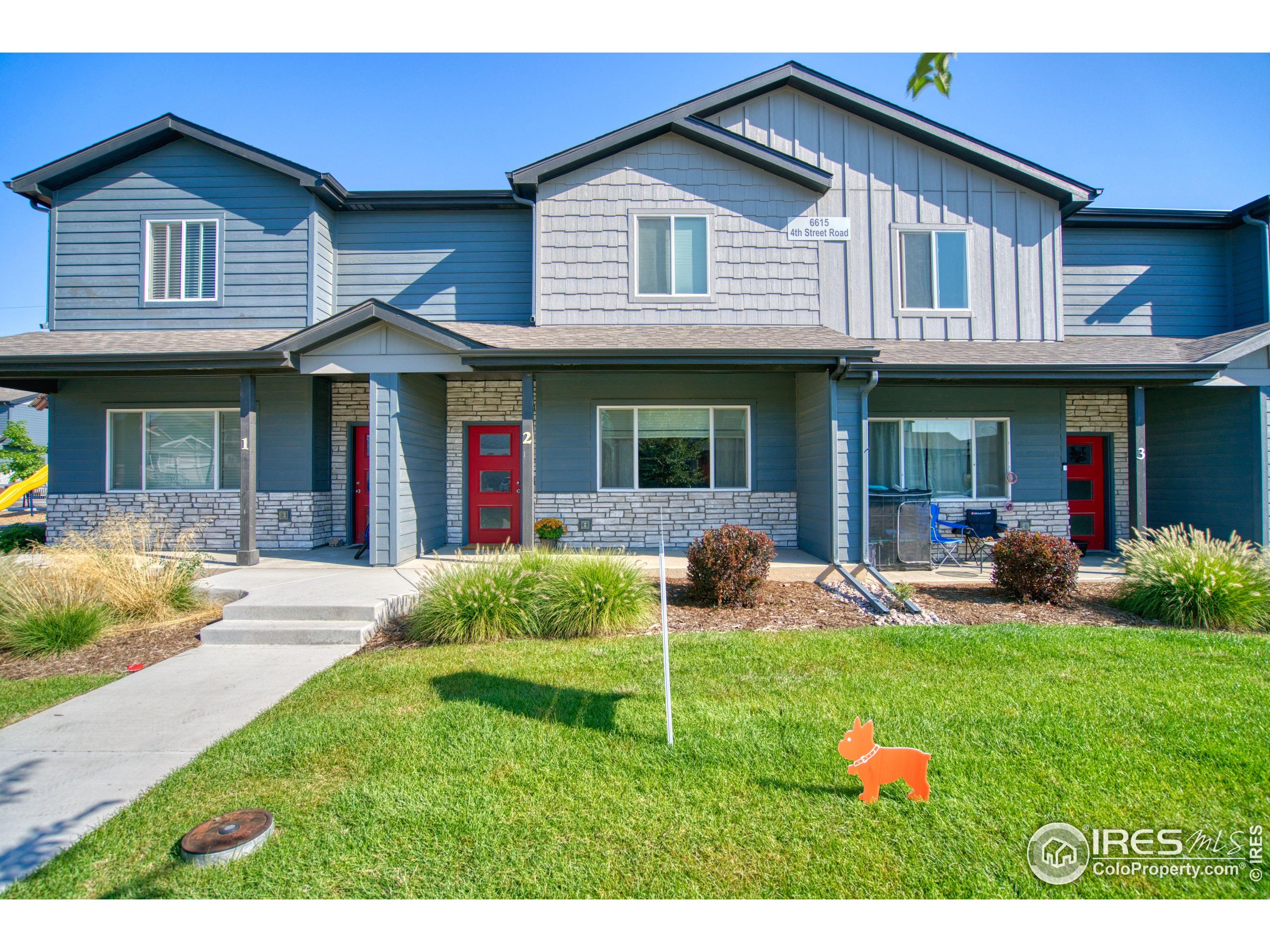 6615 4th St Road, Unit 2 Greeley, CO 80634 - Photo 22 of 31 a view of a house with a yard and plants