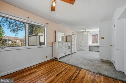 a view of a hallway with a wooden cabinets