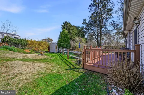 a view of a house with a yard porch and sitting area