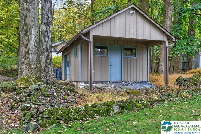 a view of a house with a small yard