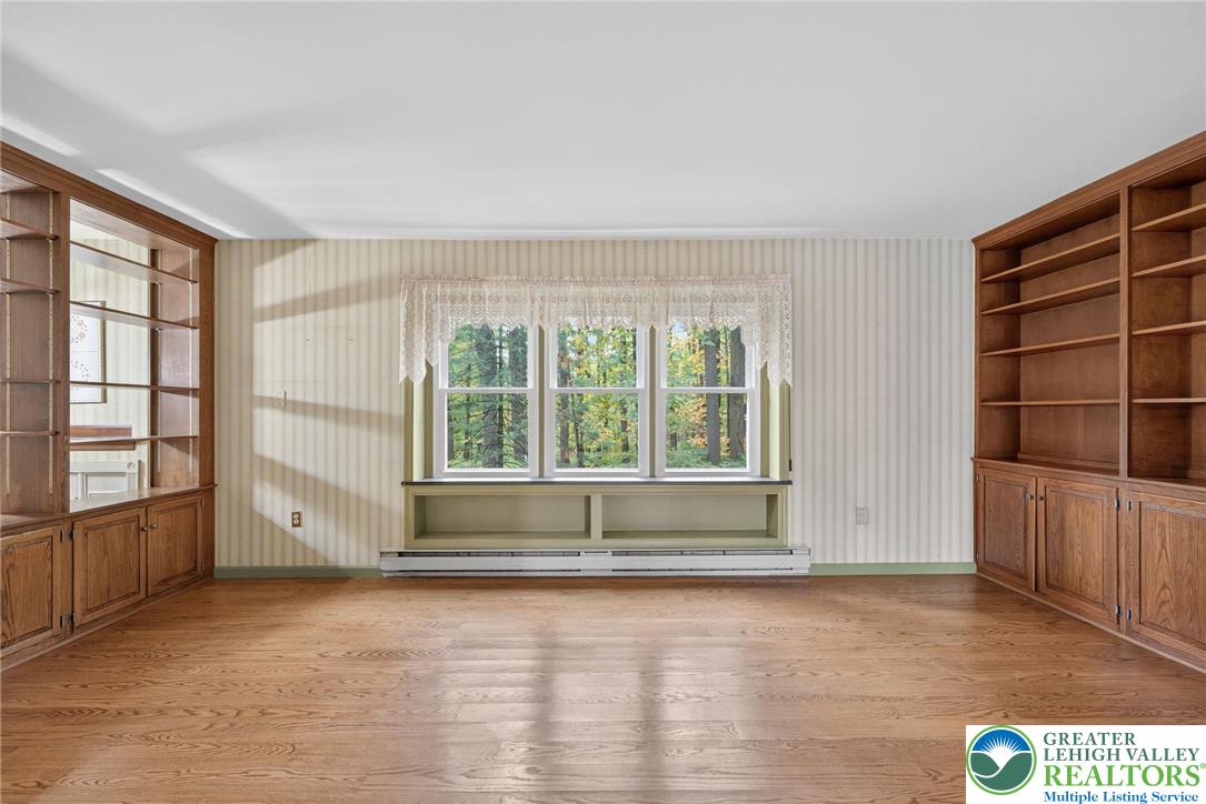 340 Chestnut Hill Road Emmaus, PA 18049 - Photo 22 of 49 an empty room with windows and cabinet