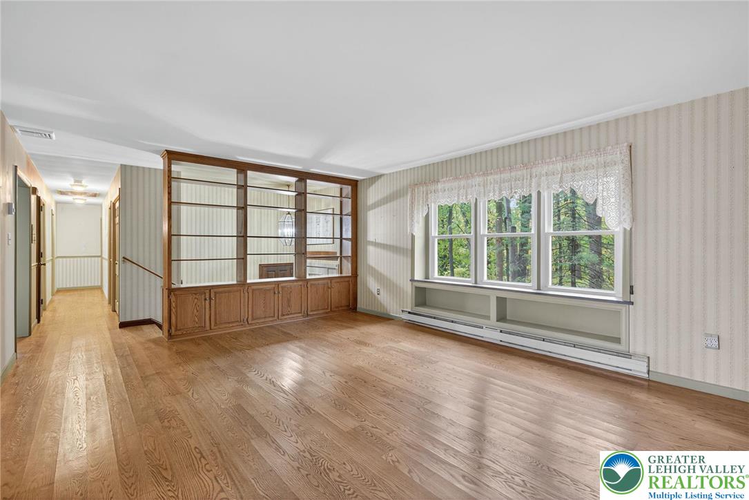 340 Chestnut Hill Road Emmaus, PA 18049 - Photo 23 of 49 wooden floor in an empty room with a window