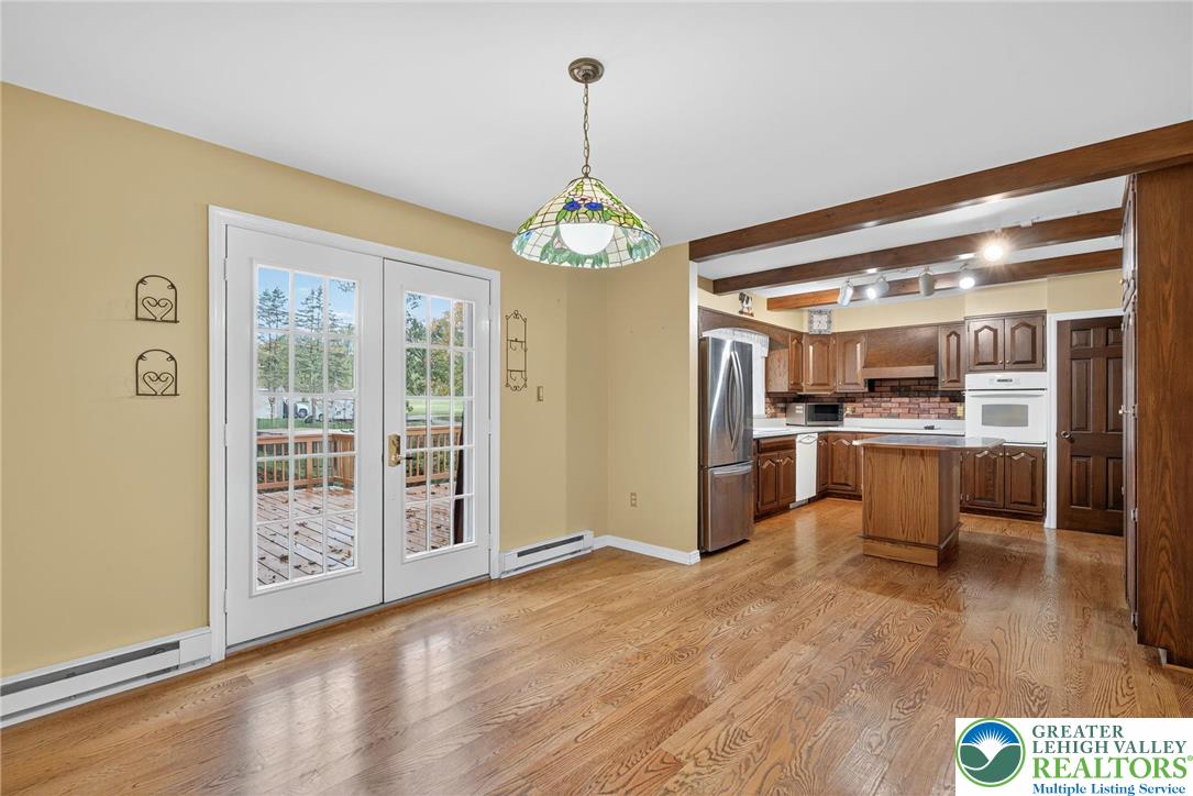 340 Chestnut Hill Road Emmaus, PA 18049 - Photo 27 of 49 a view of a kitchen with refrigerator and wooden floor