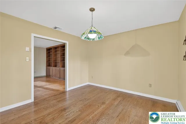 a kitchen with stainless steel appliances granite countertop a refrigerator a sink and a stove