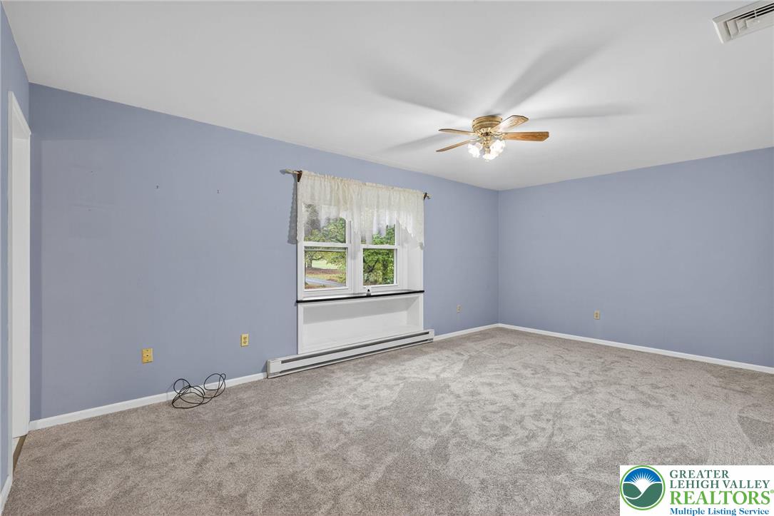 340 Chestnut Hill Road Emmaus, PA 18049 - Photo 36 of 49 an empty room with windows and fan