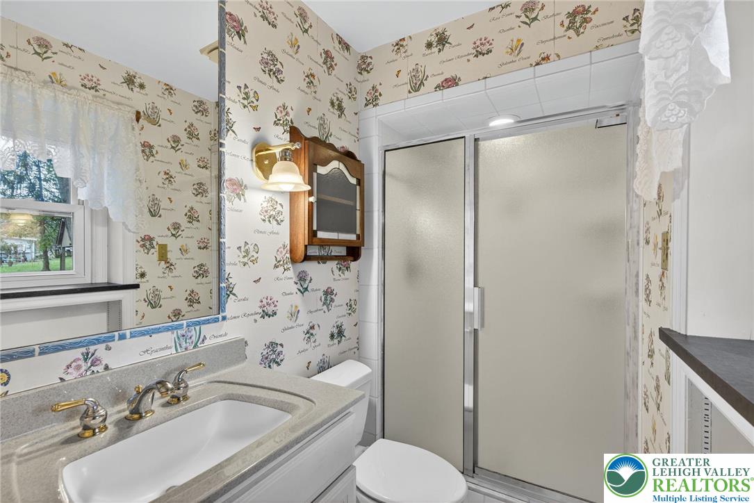 340 Chestnut Hill Road Emmaus, PA 18049 - Photo 38 of 49 a bathroom with a granite countertop sink toilet and shower