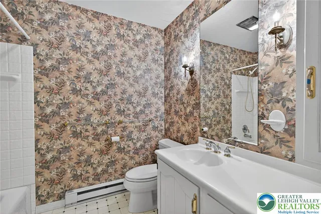 a view of an empty room with a fireplace