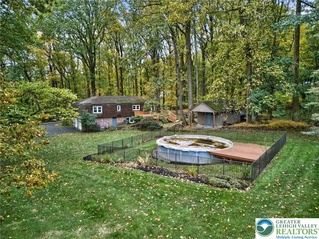 a view of a house with a yard porch and sitting area