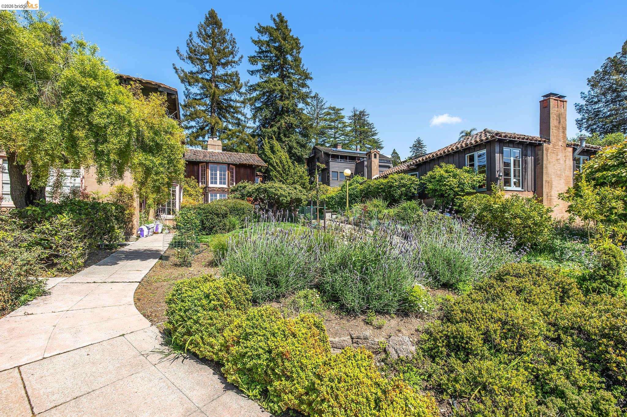 2501 Rose Walk Berkeley, CA 94708 - Photo 23 of 60 a front view of a house with a yard