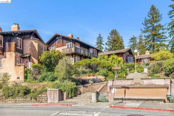 a vase of flowers sitting on a table with window