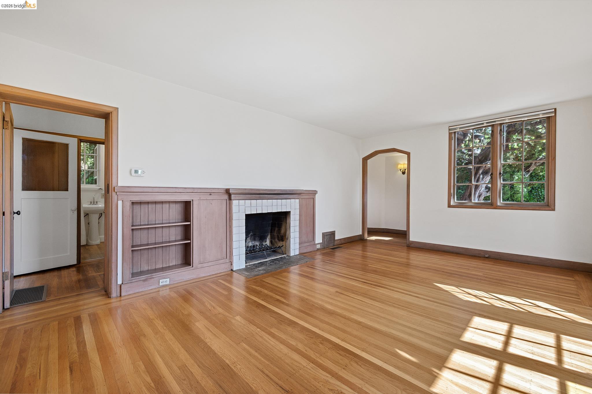 2501 Rose Walk Berkeley, CA 94708 - Photo 37 of 60 a view of empty room with wooden floor and fireplace