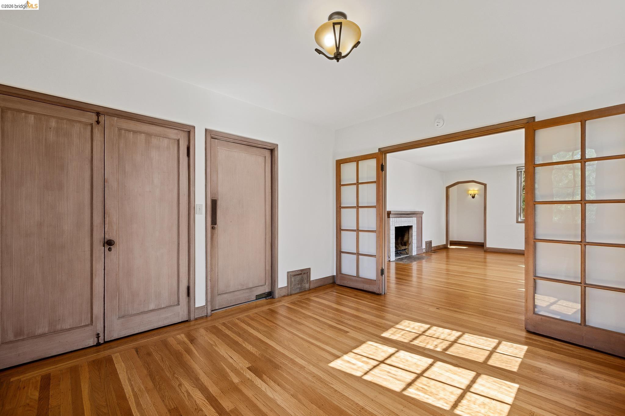 2501 Rose Walk Berkeley, CA 94708 - Photo 40 of 60 a view of empty room with window and wooden floor
