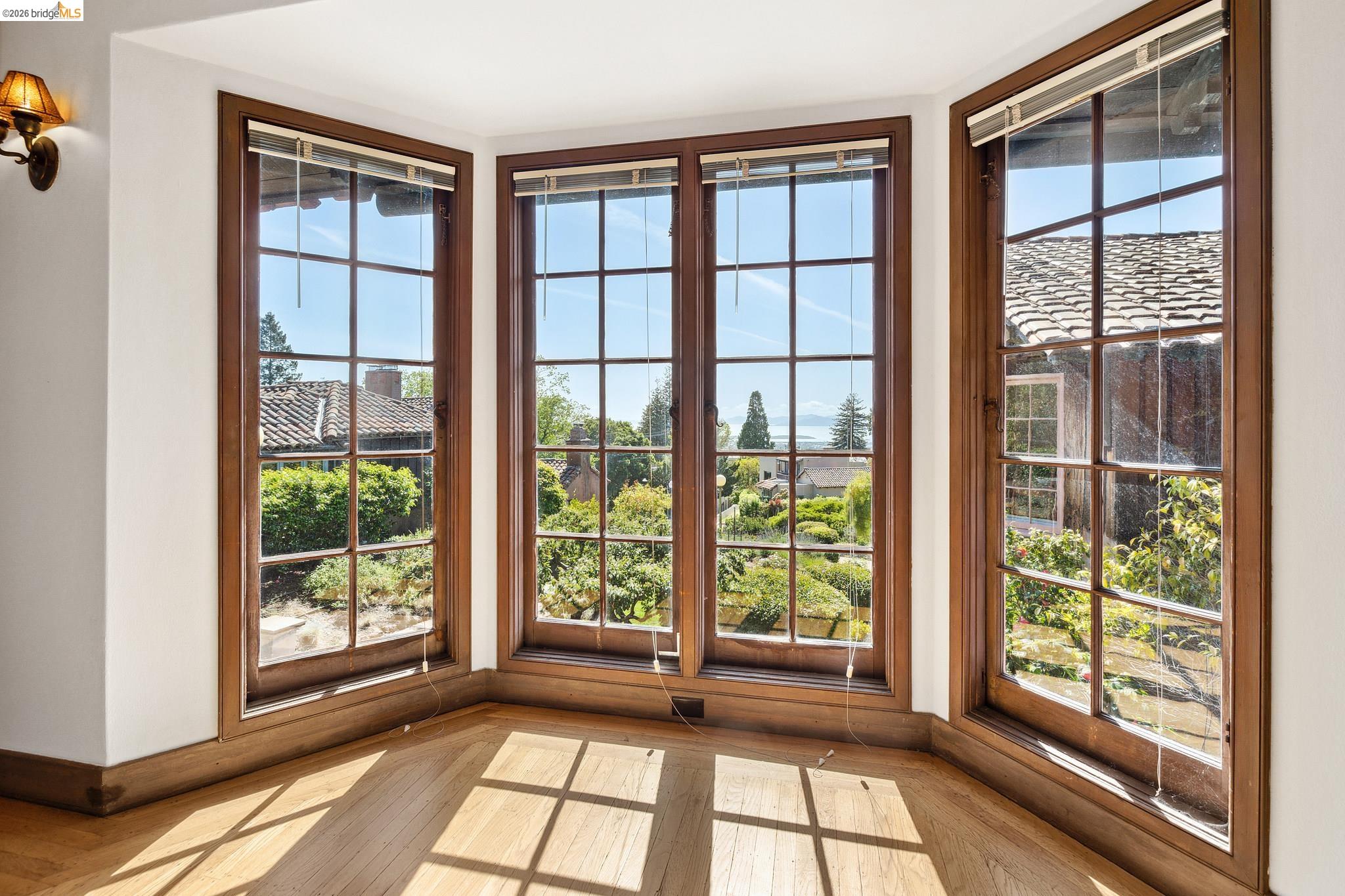 2501 Rose Walk Berkeley, CA 94708 - Photo 49 of 60 a view of empty room with wooden floor and windows