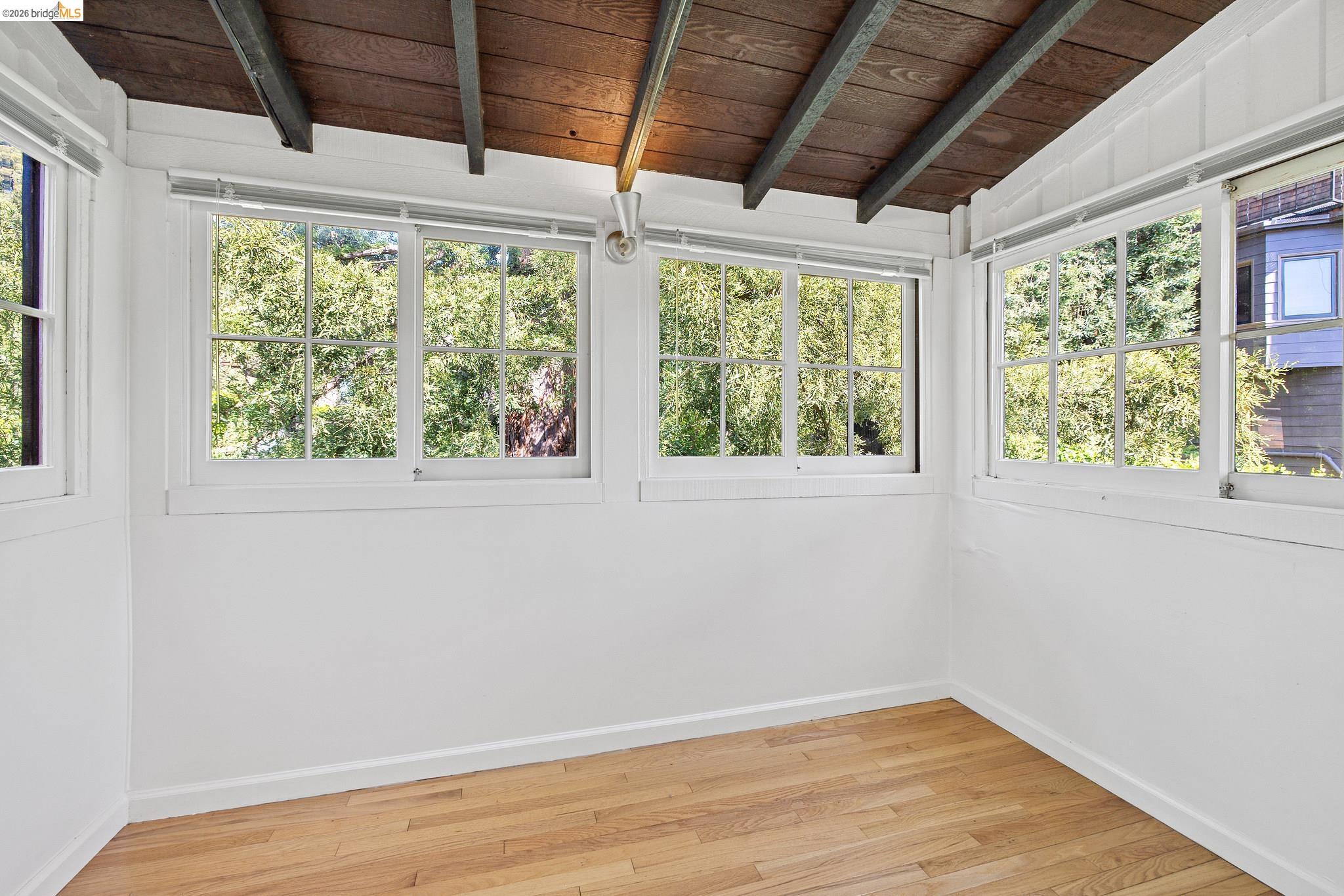 2501 Rose Walk Berkeley, CA 94708 - Photo 57 of 60 a view of a big room with wooden floor and doors