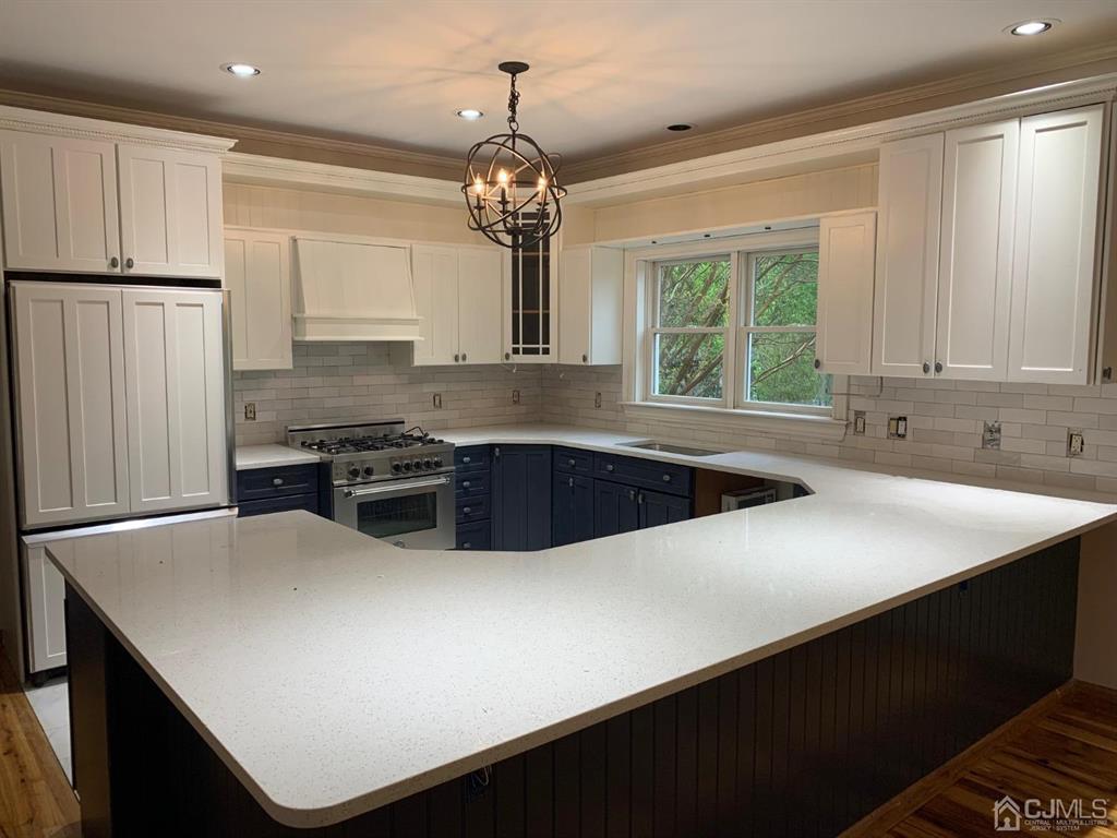 54 Cranbury Neck Road Cranbury, NJ 08512 - Photo 11 of 11 a kitchen with stainless steel appliances a sink stove and refrigerator