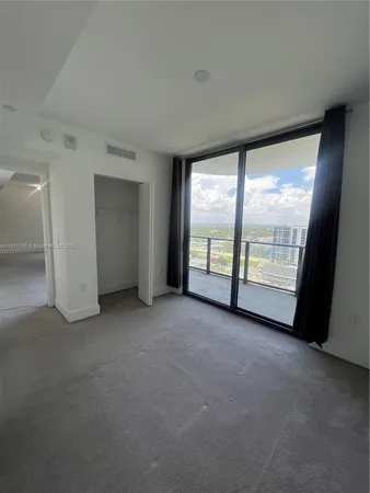 a bathroom with a sink a tub and a mirror