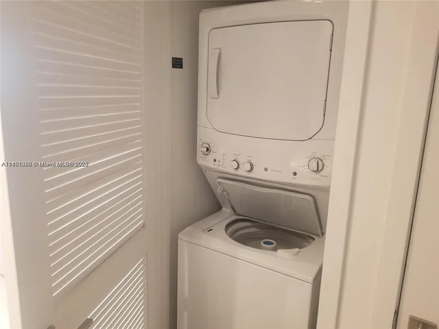 a white toilet sitting next to a shower