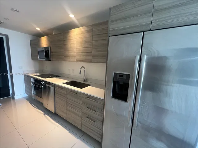 a view of a kitchen with a sink