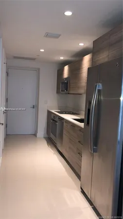 a bathroom with a sink vanity and toilet
