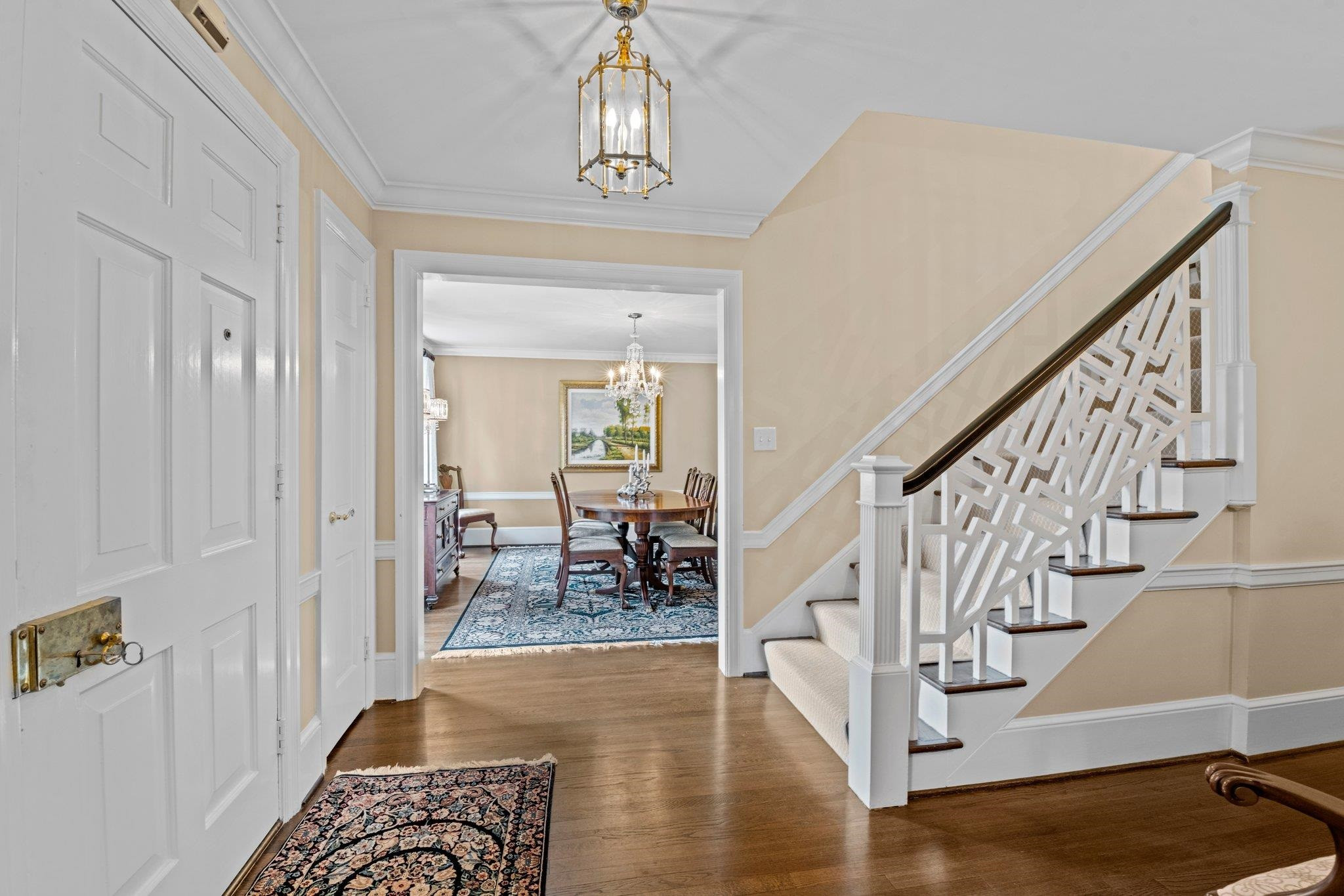 2217 St Marys Street Raleigh, NC 27608 - Photo 7 of 52 Welcoming Foyer with beautiful hardwood flooring, crown molding through out, and access to Dining Room and Living Room.