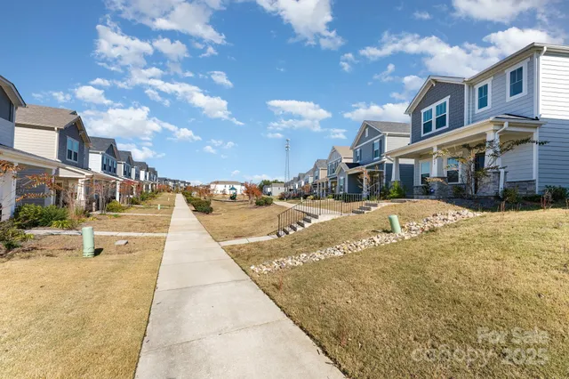 a view of a building with snow on the road