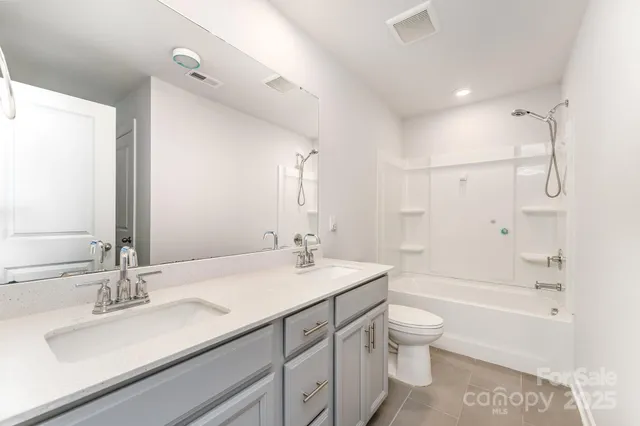 a view of a house with a snow on the road