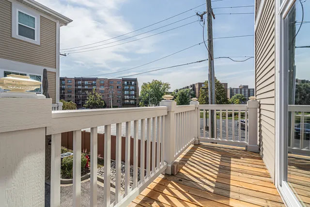 a view of a balcony with wooden floor