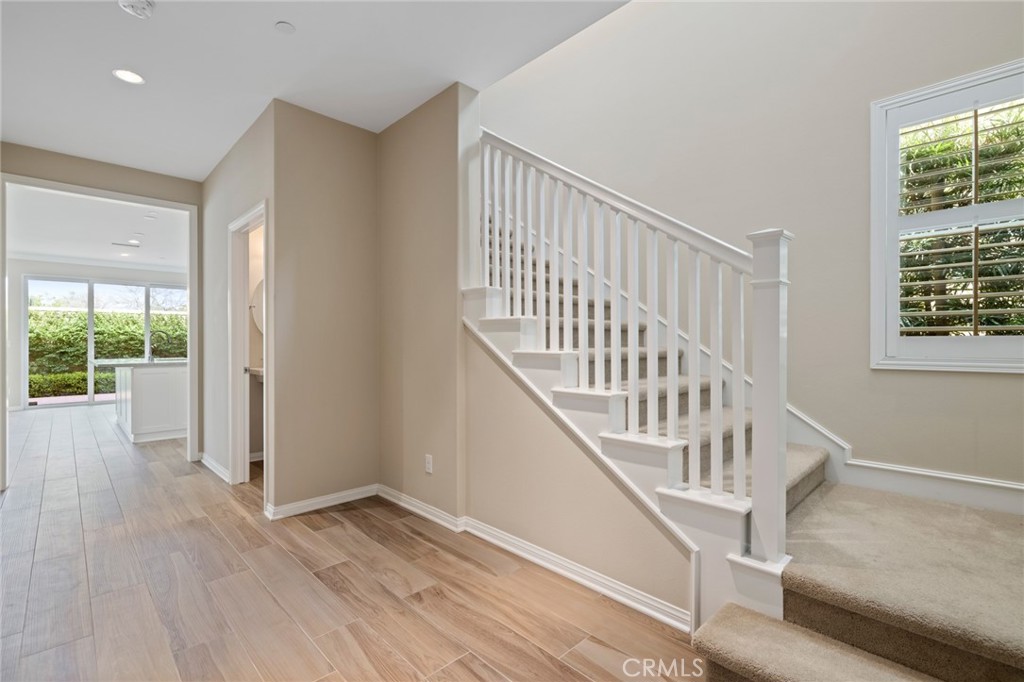 133 Waterleaf Irvine, CA 92620 - Photo 15 of 22 a view of entryway with wooden floor and stairs