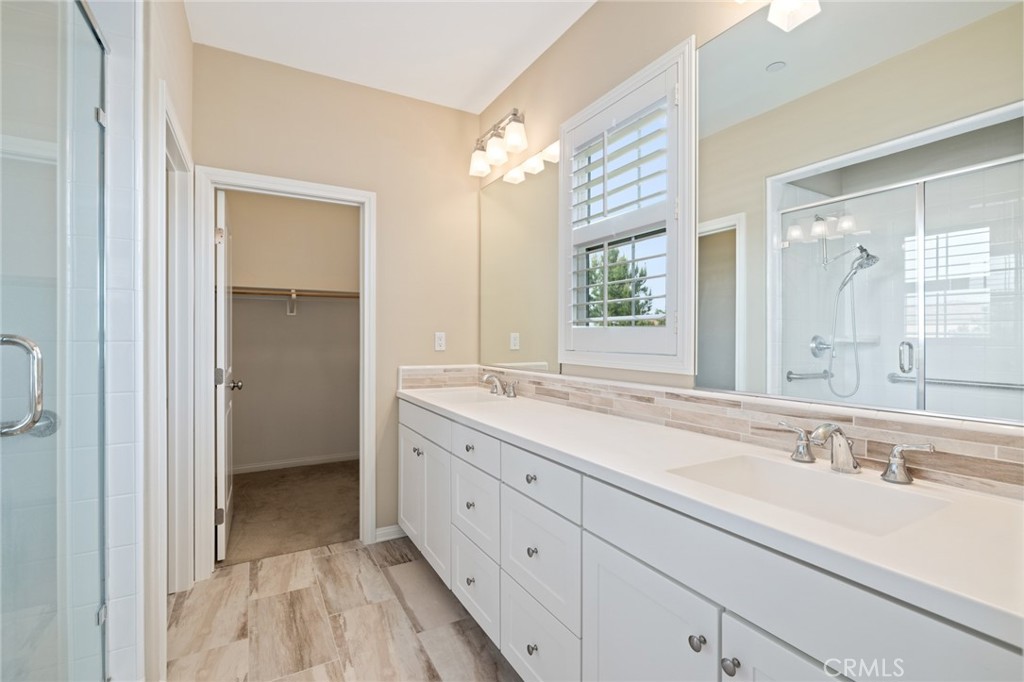 133 Waterleaf Irvine, CA 92620 - Photo 18 of 22 a bathroom with a double vanity sink mirror and next to a window